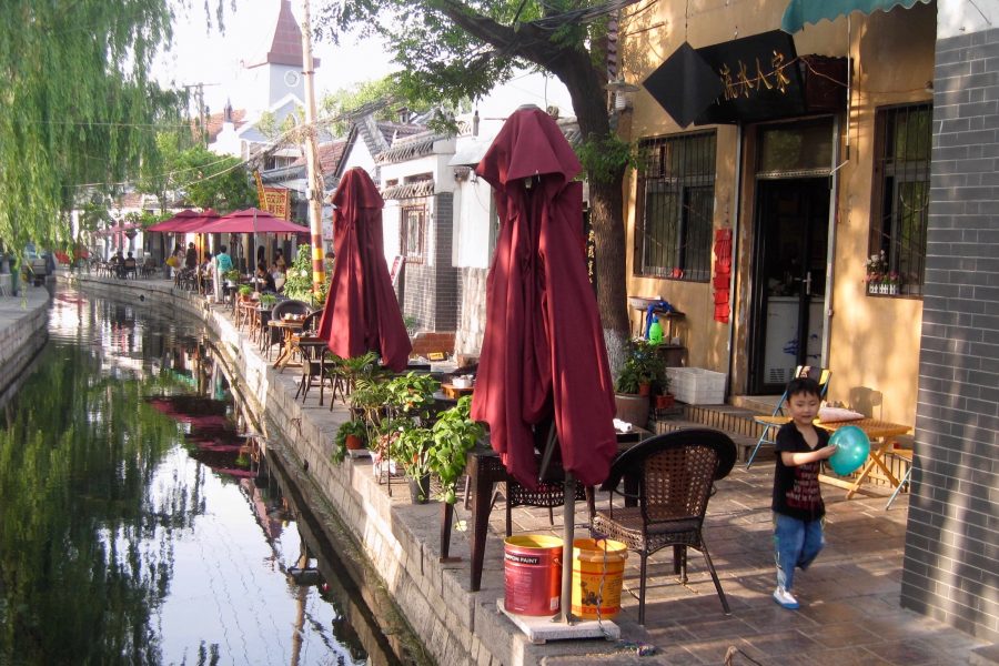 A kid playing by a canal in Jinan, the city where I work as an expat teaching English in China. ©KettiWilhelm2015
