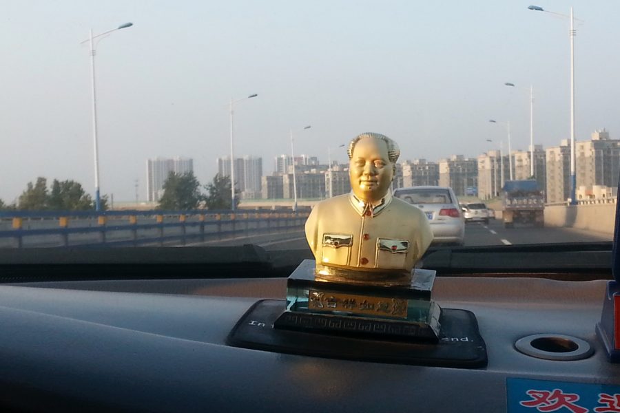 Communist leader Mao Zedong as a decoration on the dashboard of a Chinese taxi.