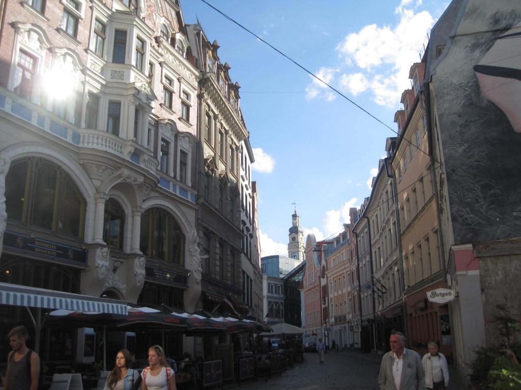 Pedestrians and elegant buildings on a curved street in downtown Riga, Latvia.  ©KettiWilhelm2015