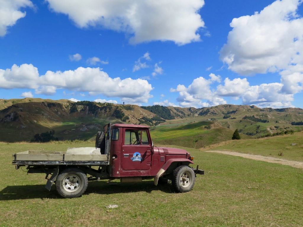 A vintage truck parked outside New Zealand's Tongariro National Park under beautiful blue skies. ©KettiWilhelm2016