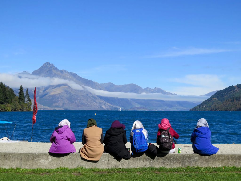Tourists (women in headscarves) watching Lake Wakatipu, in Queenstown, New Zealand. ©KettiWilhelm2016