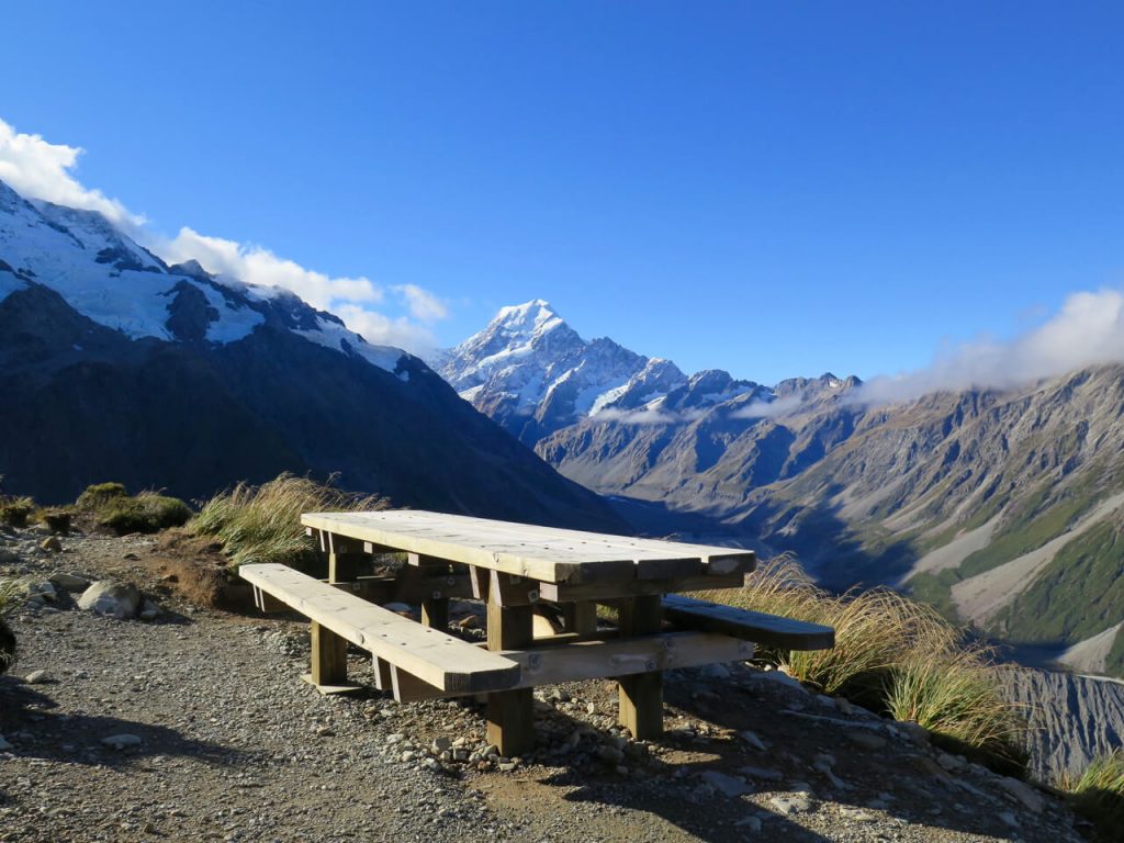 A pic-nic table, sunshine, and New Zealand's Mount Cook in the distance. ©KettiWilhelm2016