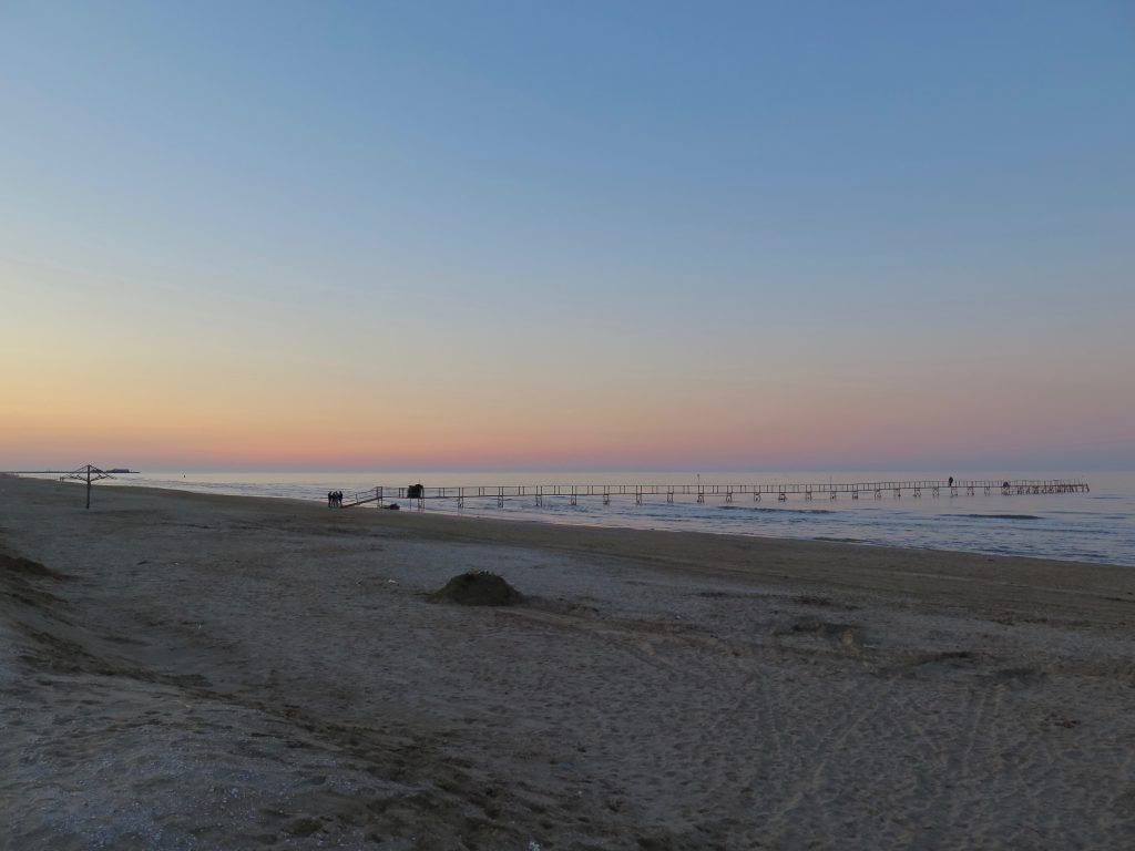 A calm, quiet sunset on the beach in Rimini, Italy.