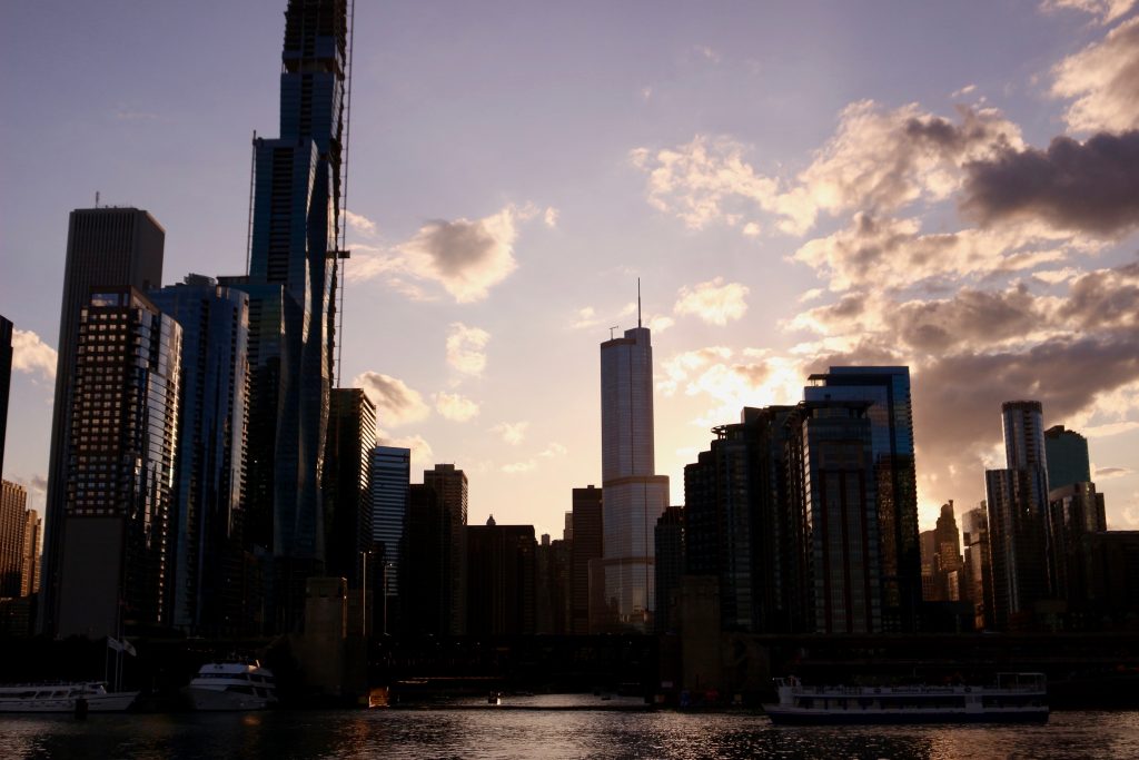 The dark Chicago skyline at sunset seen from Lake Michigan aboard an architecture boat tour. ©KettiWilhelm2019