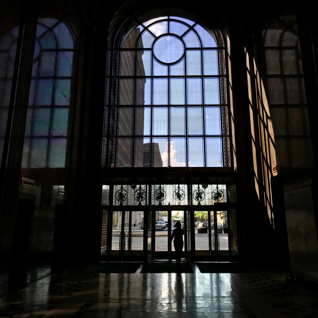 Sunlight on the glass front doors of Detroit's art-deco-style Fischer Building. ©KettiWilhelm2019