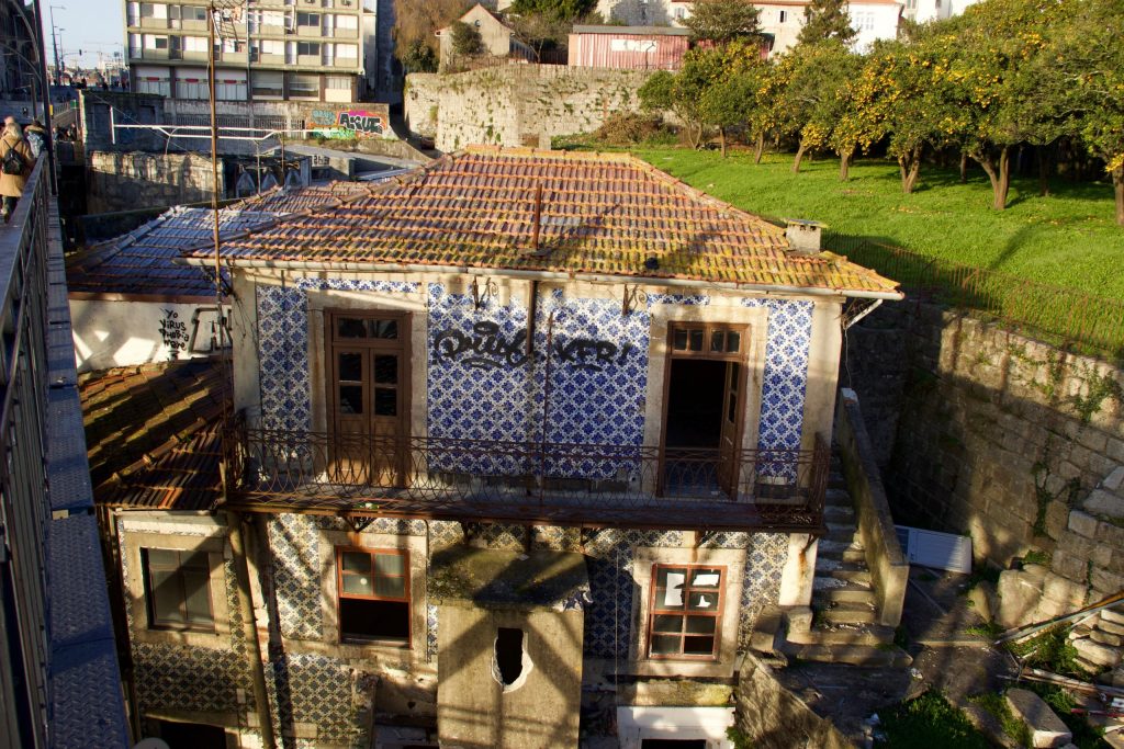 Porto is filled with a mix of abandoned homes and those freshly renovated, as seen here from Porto’s Dom Luis I Bridge. ©KettiWilhelm2020