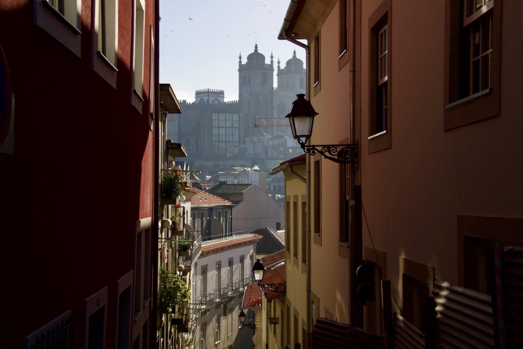 Looking down an alley in Porto, Portugal, toward the Church of Santa Clara in the mist. ©KettiWilhelm2020