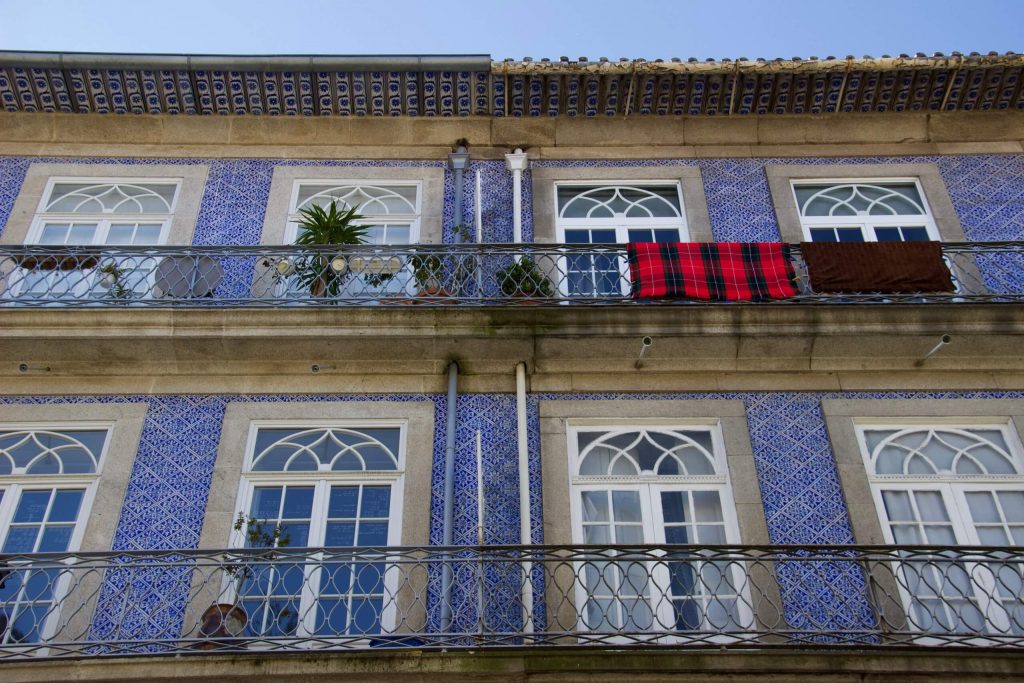 Homes with balconies and blue tiles seen on a two-day Couchsurfing layover in Porto, Portugal. ©KettiWilhelm2020