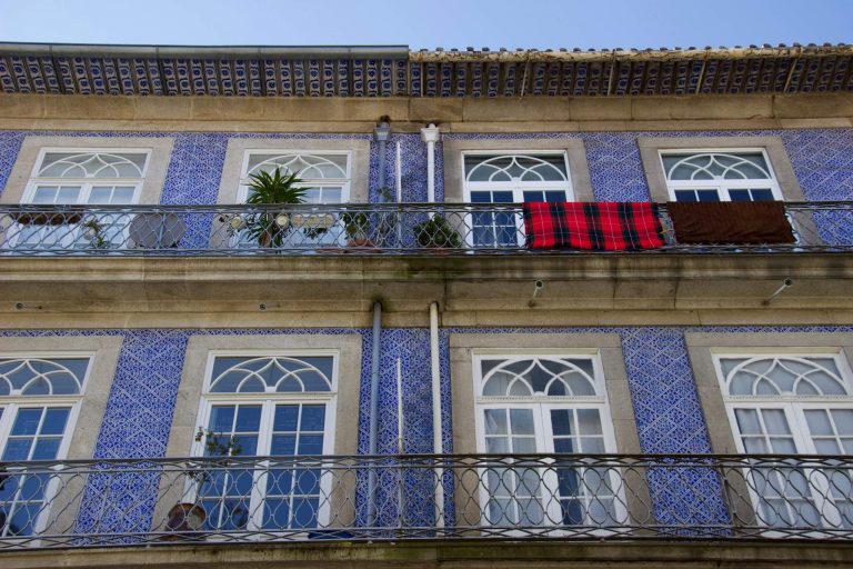 Homes with balconies and blue tiles seen on a two-day layover in Porto, Portugal. ©KettiWilhelm2020