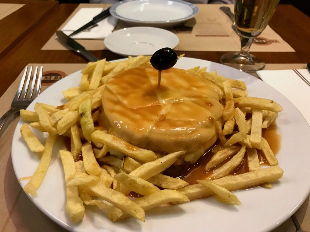 A Francesinha sandwich – Porto’s famous local food – bathed in beer sauce and cheese. ©KettiWilhelm2020