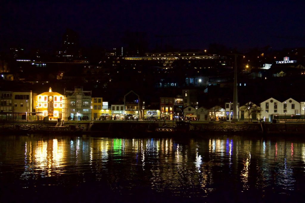 Lights reflecting on the Douro River at night from the port wine wineries in Vila Nova de Gaia. ©KettiWilhelm2020