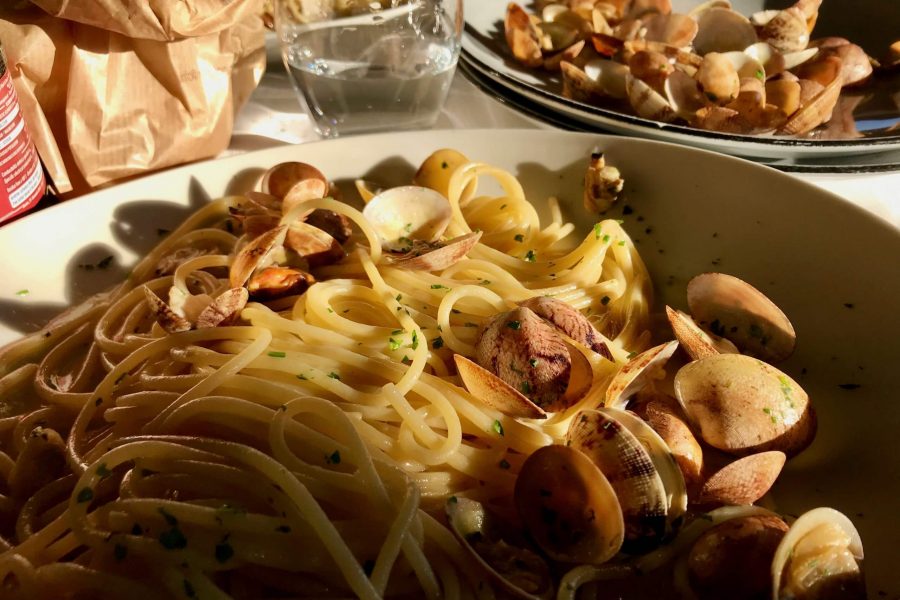 A plate of spaghetti con vongole (spaghetti with fresh clams) in Naples, Italy. ©KettiWilhelm2020