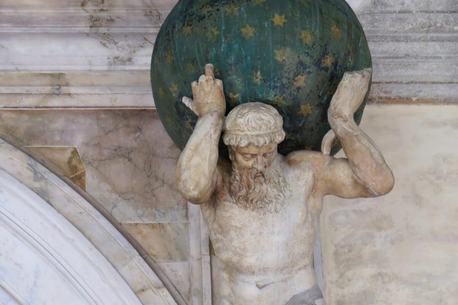 A sculpture in Venice, Italy, of Atlas holding up a a green globe, dotted with gold stars to represent the heavens. ©KettiWilhelm2017