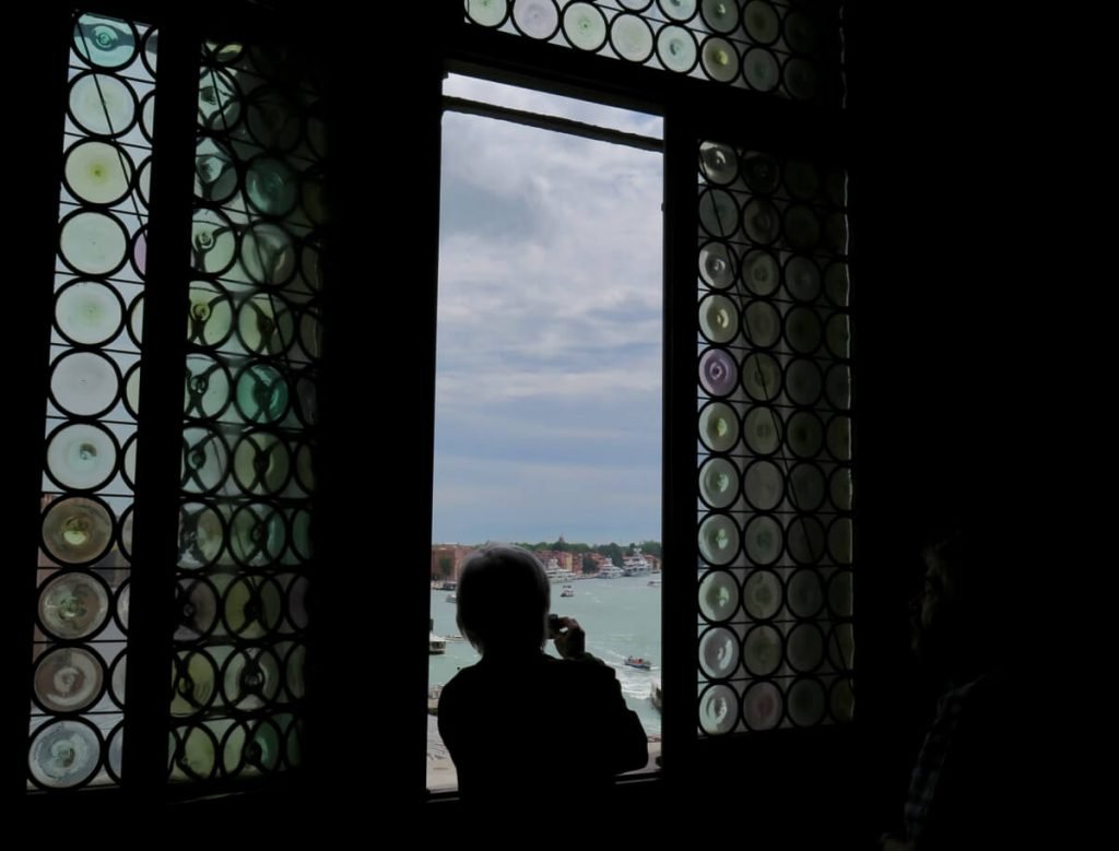 Looking out a stained glass window at the port of Venice, Italy, where you can see both the past and the future of travel. ©KettiWilhelm2017