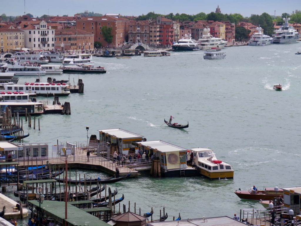 Cruise ships, ferries, and old-fashioned Italian gondolas in the port of Venice, Italy. ©KettiWilhelm2017