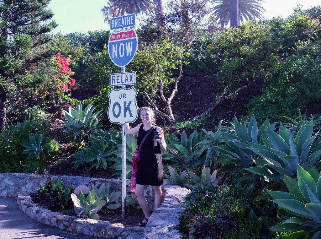 Dealing with reverse culture shock by doing what this sign says, by the beach in California: “breathe.” ©KettiWilhelm2018