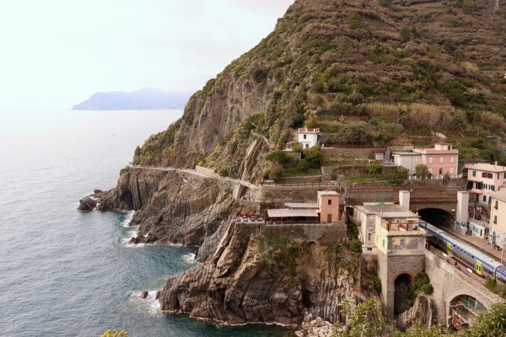 Looking down on the TrenItalia train station in Riomaggiore, Italy, from viewpoint on the cliffs above. ©KettiWilhelm2020