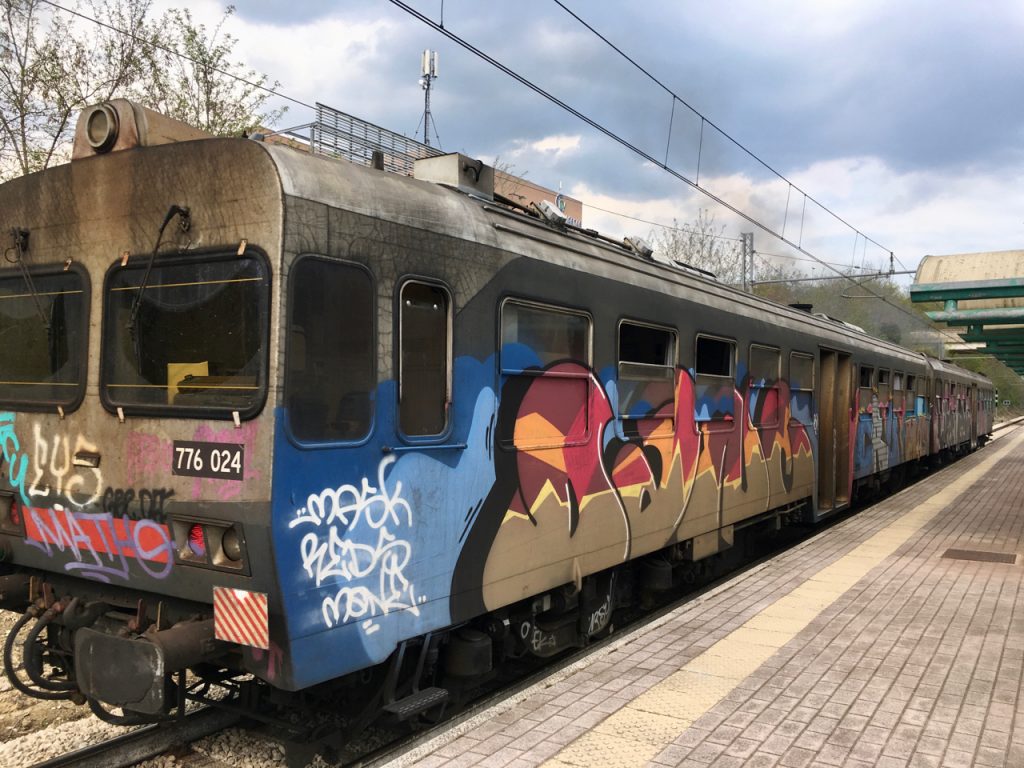 A regional train in Umbria, Italy, covered in colorful graffiti. ©KettiWilhelm2020