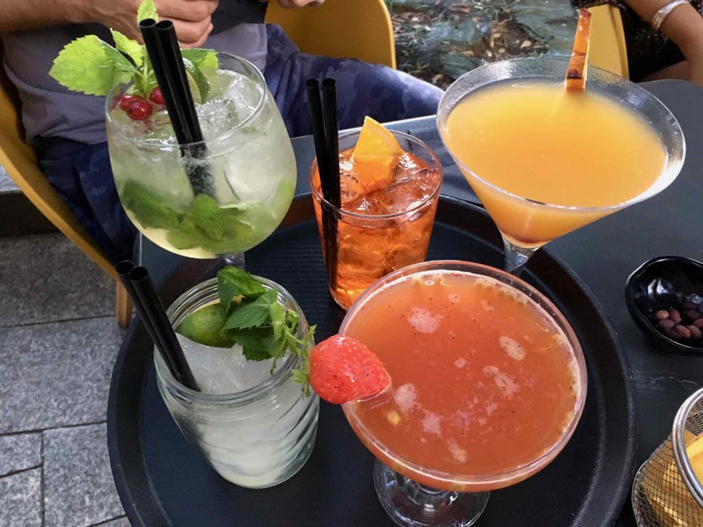 A variety of colorful cocktails on a serving tray for aperitivo in Milan, Italy. ©KettiWilhelm2021