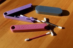 LastObject's two versions of their reusable Q-Tip (basic, in pink, and beauty, in purple) shown with EarthSider's knock-off/ counterfeit version of the product (in gray) for this review. ©KettiWilhelm2020