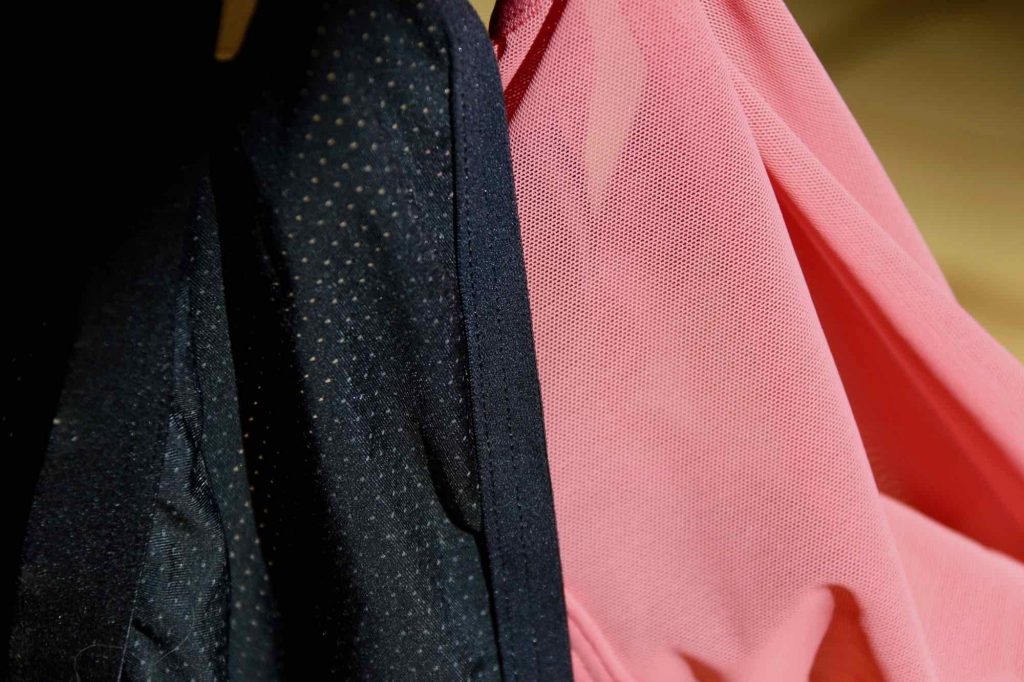 A close-up of two pairs of Thinx period underwear hanging on a laundry line: The soft, perforated fabric of the Thinx Air on the left, and the mesh of the Hi-Waist style on the right. ©KettiWilhelm2021