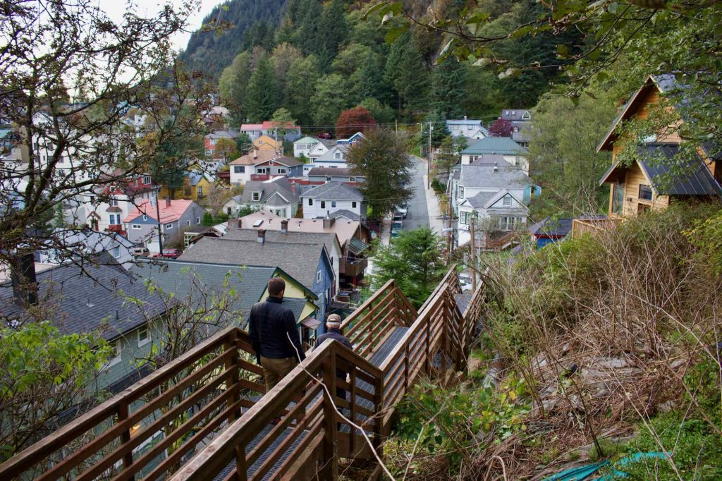 A wooden sidewalk in Juneau, Alaska’s, downtown residential area, raised on stilts to accommodate the hilly, rainy, thickly forested surroundings. ©KettiWilhelm2021