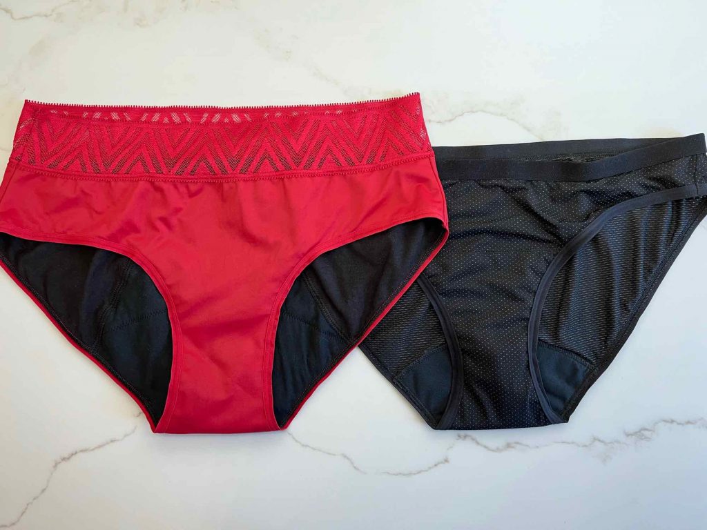 Two pairs of Thinx period underwear: the Hiphugger style, with a lacy waistband in bright red, and the Thinx Air Bikini in simple black. ©KettiWilhelm2021