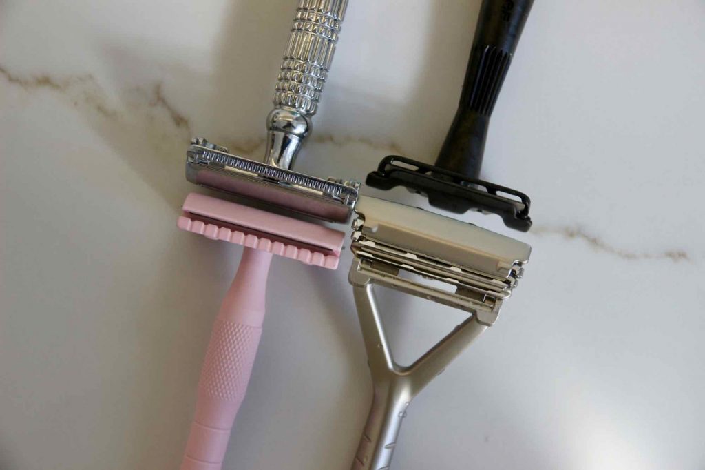 Close-up of the heads of the four sustainable razors in this review. Clockwise from top left: Albatross butterfly razor, Leaf Shave's Twig safety razor, original Leaf razor, and Well Kept. ©KettiWilhelm2021