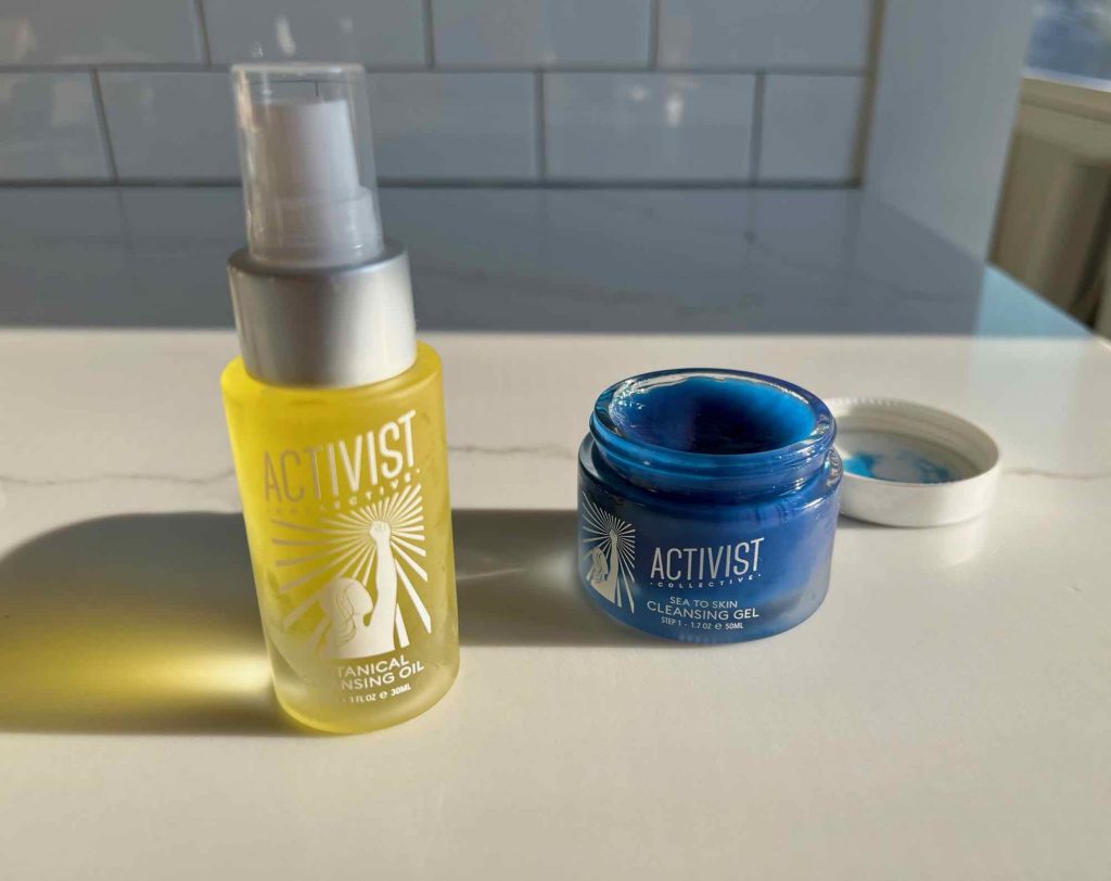 Activist Skincare's Botanical Cleansing Oil, a bright yellow liquid in a refillable glass pump bottle, and Sea to Skin Cleansing Gel, a bright blue oil-based gel in a refillable glass jar. ©KettiWilhelm2022