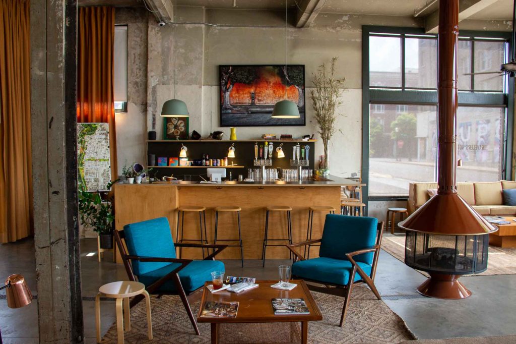 The lobby and bar of the stylish, sustainable, and locally-owned Travelers Hotel in downtown Clarksdale, Mississippi. ©KettiWilhelm2022