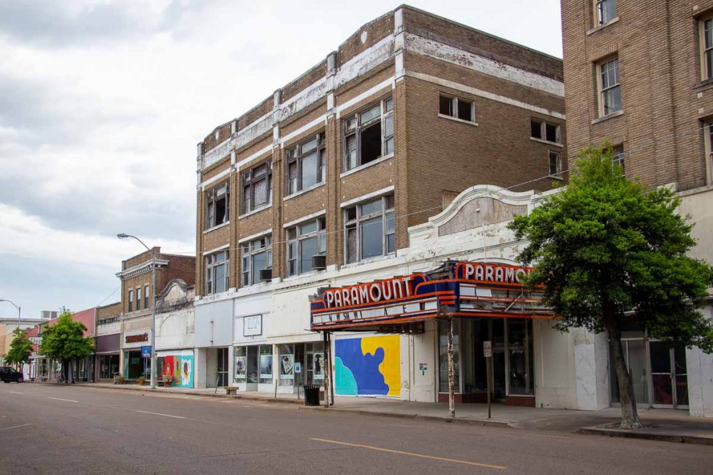 The front of the Paramount Theatre in downtown Clarksdale, Mississippi, with broken windows above the sign. ©KettiWilhelm2022