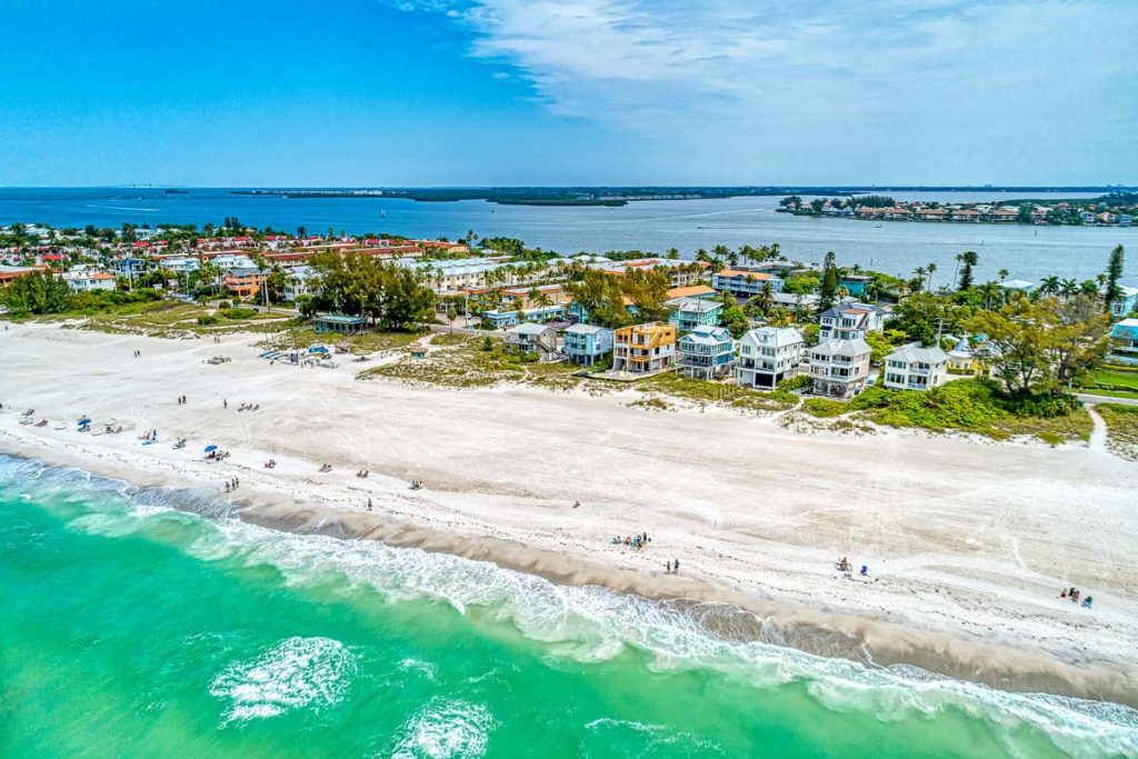 A row of beachfront vacation rental properties on Anna Maria Island, Florida, bookable on the Airbnb alternative website VacayMyWay.