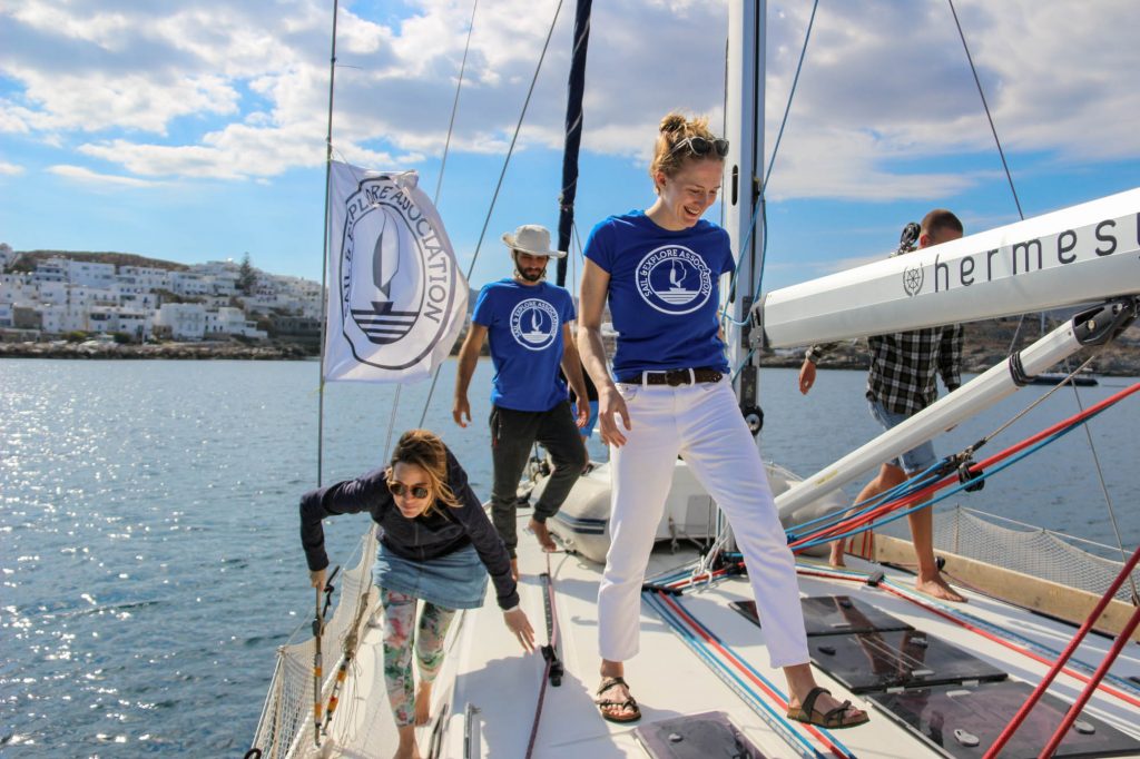 Ketti Wilhelm, the author of this blog, walking across the deck of a sail boat, while on a scientific research trip with Sail & Explore. ©KettiWilhelm2022