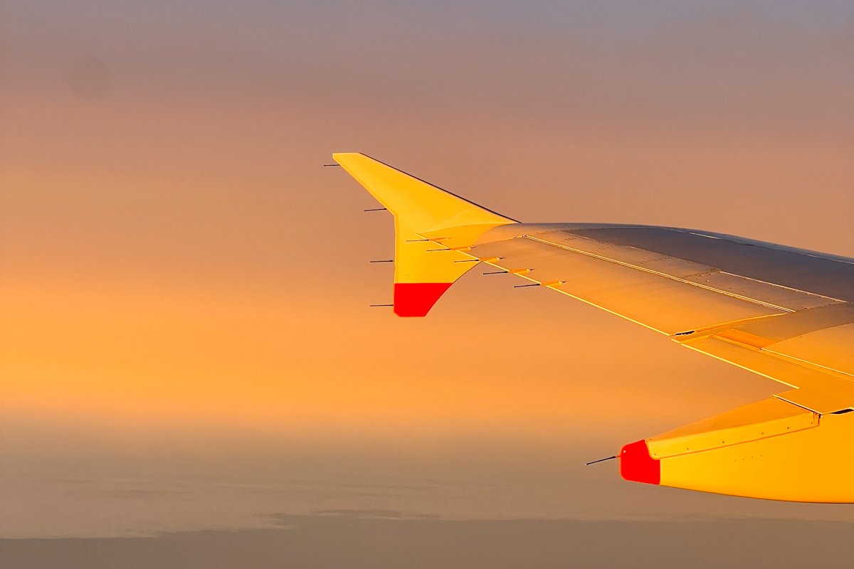 I calculated the carbon emissions from my flights this year, while sitting on a plane over the Atlantic with this sunset view out the airplane window. ©KettiWilhelm2022