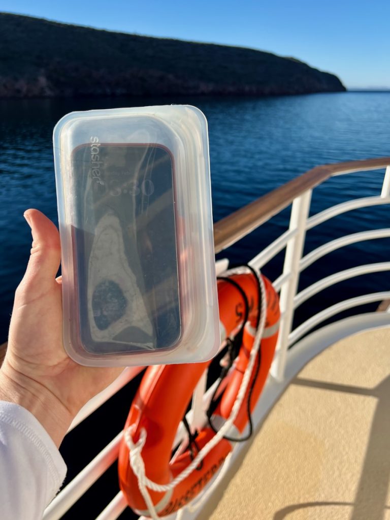 A reusable Stasher bag with an iPhone inside it for water-protection on the deck on our UnCruise ship in Baja California. ©KettiWilhelm2023