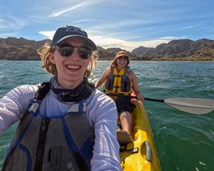 Two women smiling in a sea kayak – the author and her friend, who joined for this UnCruise trip in Baja. ©KettiWilhelm2023