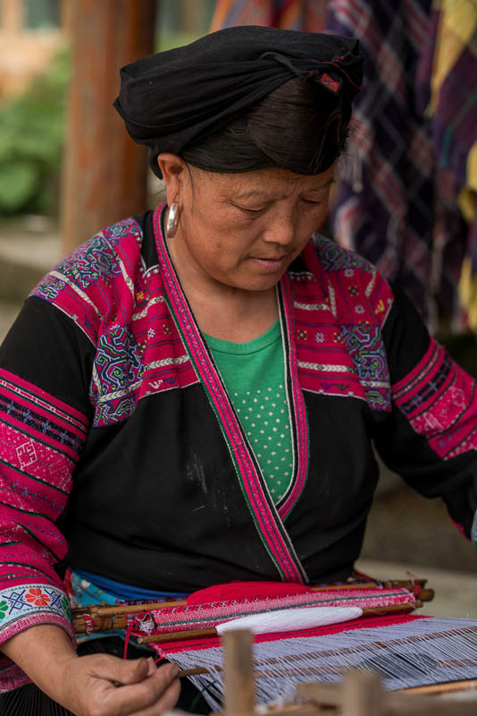 A woman of the Red Yao tribe, who work with the Viori shampoo bar brand, working on a piece of traditional embroidery.