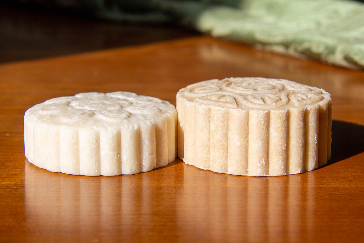 Two of my Viori rice shampoo bars, both similar shades of natural beige. One is much smaller, after about three weeks of use, the other is brand new, showing how long Viori shampoo bars last. ©KettiWilhelm2023