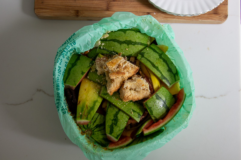 Watermelon rinds, banana peels, and other food waste collected in a compostable plastic bag before transferring the whole thing to the Lomi. ©KettiWilhelm2023