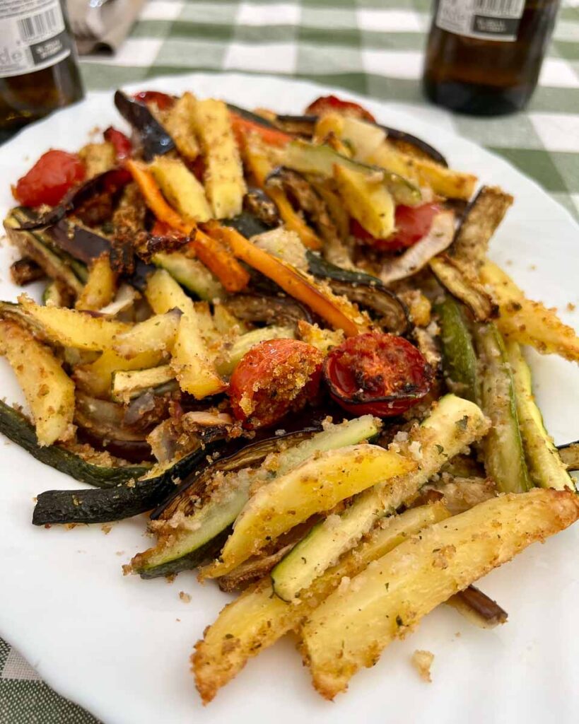 A contorno, or side dish in Italian, of grilled and lightly breaded vegetables served at the agriturismo where we ate lunch on our e-bike tour in Italy's March region. ©KettiWilhelm2023