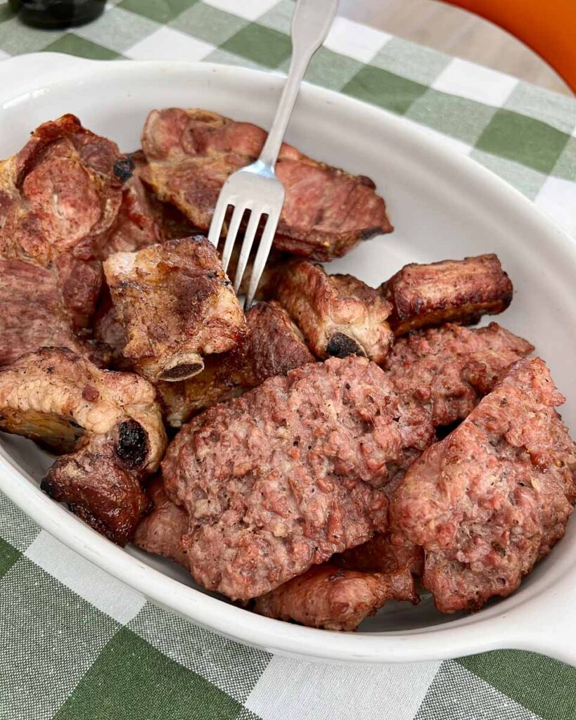 A second course of local grilled meats served at the agriturismo where we ate lunch during our e-bike tour in Italy's March region. ©KettiWilhelm2023