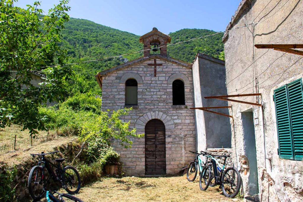 An abandoned church in the Italian ghost town of San Cristoforo, which we visited on our e-bike tour of the Marche region of Italy, with local tour operator Basecamp523. ©KettiWilhelm2023