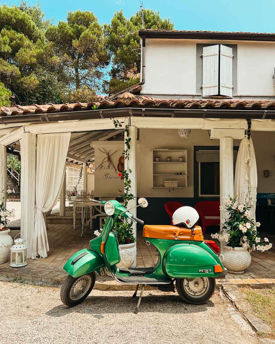 A vintage green Vespa scooter parked outside our hotel at the end of our bike tour in rural Italy.  ©KettiWilhelm2023