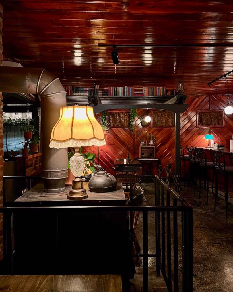 The cozy, warm interior décor at Woodshed on Park, one of the best restaurants in the Adirondacks. ©KettiWilhelm2023