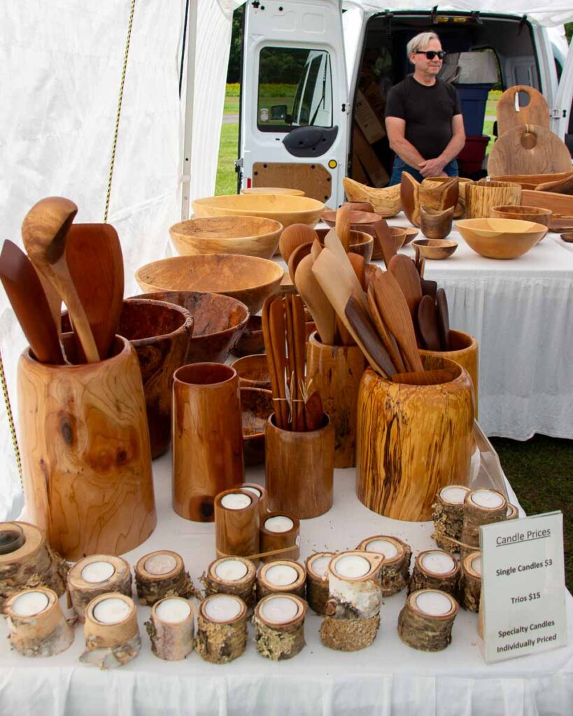 Hand-made wooden bowls sit on a table at the Keene Valley Farmers’ Market in upstate Keene, New York. ©KettiWilhelm2023