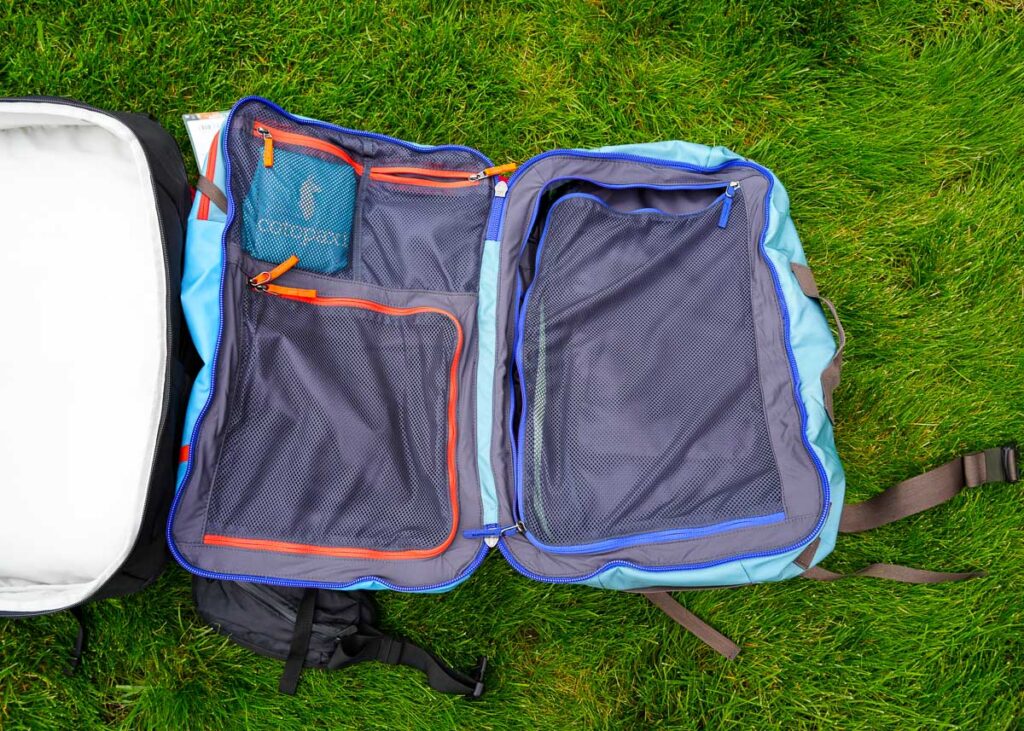The main compartment of the Cotopaxi Allpa travel backpack holds 35L of clothing, and has several small organizational pockets with zippers. ©KettiWilhelm2023