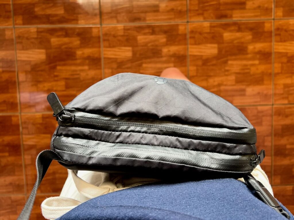Wearing my Tortuga Travel Sling as small travel daypack that fits a camera. ©KettiWilhelm2023