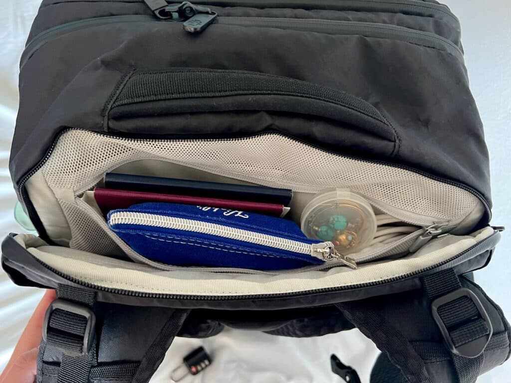 Passports, jewelry, and other small valuables inside the lockable designated laptop pocket on the safest travel backpack I found for this review – Tortuga travel backpack. ©KettiWilhelm2023