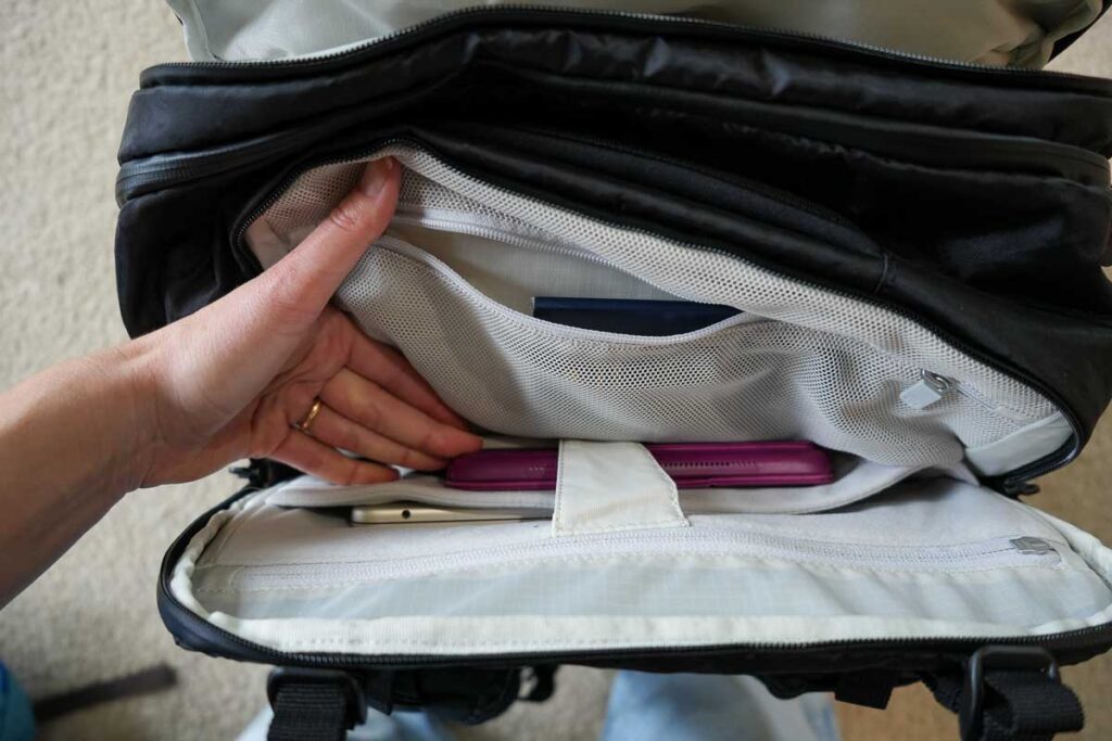 A MacBook Air 13” and an iPad can both fit inside the lockable, padded laptop compartment on the Tortuga backpacks, the safest travel backpack in this review. ©KettiWilhelm2023