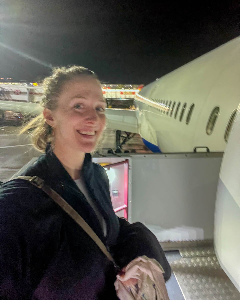 Sustainable travel writer exciting to fly - boarding a flight she thought she wouldn't make. ©KettiWilhelm2023